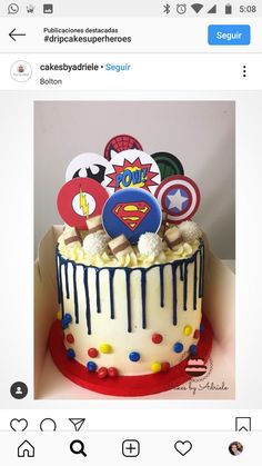 the cake is decorated with fondant, buttons and captain america stickers on top