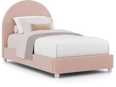 a bed with a pink headboard and white sheets on top of the bedspread