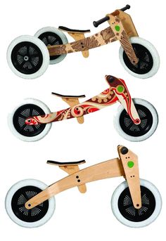 three wooden tricycles with different designs on them