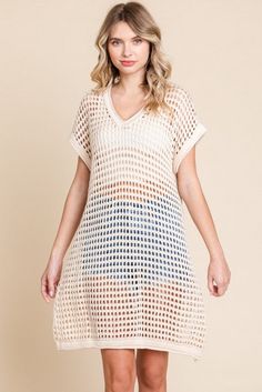 Crochet tunic dress with V-neck, short sleeves, and ribbed hems.- Unlined, sheer, lightweight. Fabric: 100% cotton Measurements: Bust: small 38", medium 40", large 42" Length: small 30", medium 32", large 34" Spring Knit V-neck Cover-up, Casual Crochet Dress With Pointelle Knit And V-neck, Casual Beige V-neck Cover-up, Spring V-neck Open Knit Cover-up, Stretch Crochet V-neck Dress For Vacation, Summer Pointelle Knit Crochet Dress, Summer Stretch Crochet Dress With V-neck, Spring Crochet Dress Short Sleeve For Day Out, Summer Pointelle Knit V-neck Crochet Dress