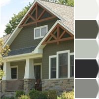 the exterior of a house with gray and white paint samples on it, including two different colors