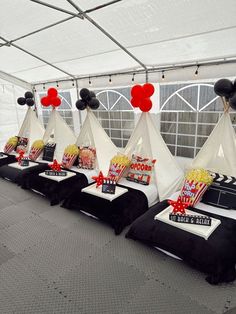 a row of tents with black and white decorations