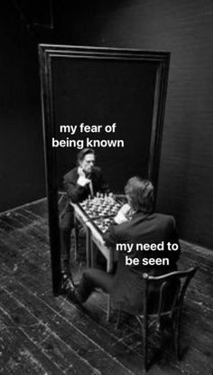 two people sitting at a table in front of a mirror with the words, my fear of being known