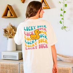 Get ready to be OBSESSED with your new Lucky Duck shirt. It's the cutest and most trendy way to emit all those positive vibes! This is the perfect silly tshirt! Great as a gift! * Q U I C K * F A C T S * ✺ 100% preshrunk cotton ✺ Wash and dry normally inside out (on cool for best results) * S I Z I N G * ✺Comfort Colors C1717 ✺ Sizing is unisex so runs like men's, though not overly large ✺ Most women find their typical size works best, since they are meant to fit a touch loose ✺ See size guide in photos for more info * S H I P P I N G * T I M E S * ✺ Our items are individually made with love for each of our buyers. Because of this, our processing time is 2-5 business days (depending on order volume) plus transit time, but typically much faster. We know our customers want their items as qui Cute Short Sleeve T-shirt With Screen Print, Cute Spring T-shirt With Funny Text, Fun Tops With White Funny Print, Fun White Tops With Funny Print, Cute Screen Print Shirt, Cute Short Sleeve T-shirt With Letter Print, Fun White Print Crew Neck Tops, Trendy White Printed Pre-shrunk T-shirt, Fun Cotton T-shirt With Funny Print