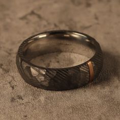 a close up of a wedding ring on the ground