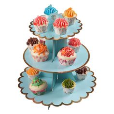 three tiered tray with cupcakes on it, each decorated in different colors