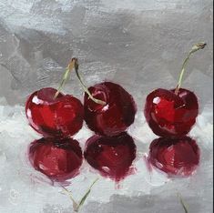 three cherries sitting on top of each other