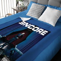 a bed with a star wars poster on it