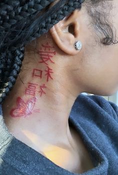 a woman with chinese writing on her neck