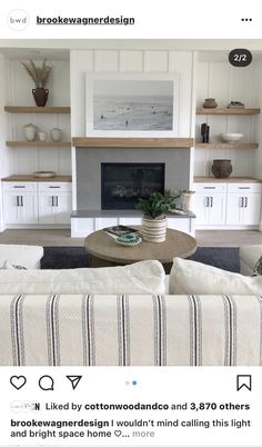 a living room filled with furniture and a fire place in front of a tv mounted above a fireplace