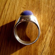 Like all of my men's rings, this has a rich, heavy weight and is solid underneath. The blue star sapphire is stunning. I make my pieces heirloom quality- built to last a lifetime. Custom handcrafted by me in my studio/workshop in Salt Lake City, Utah. You will love the weight, quality, look and feel of this ring. Stone: Finest quality, Stunning, Lab-grown Blue Star Sapphire. This lab-grown sapphire is structurally and chemically identical to a natural blue star sapphire. The only difference, rea Modern Sapphire Ring Oval Cabochon Polished Finish, Modern Sapphire Ring With Oval Cabochon And Polished Finish, Domed Sapphire Ring As A Gift, Classic Lapis Lazuli Ring With Polished Finish, Blue Oval Cabochon Signet Ring With Polished Finish, Gift Sapphire Oval Cabochon Ring With Polished Finish, Blue Domed Jewelry With Polished Finish, Oval Cabochon Dome Ring With Polished Finish As Gift, Gift Dome Ring With Oval Cabochon And Polished Finish