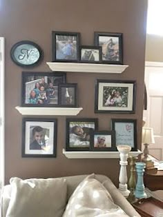 a living room with pictures on the wall