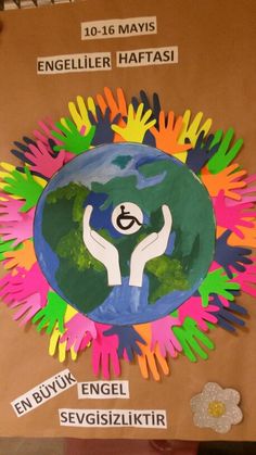 a bulletin board with hands holding the earth