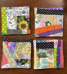 four small patchwork squares are arranged on a table top with polka dots and sunflowers