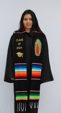 Show off your culture and roots during your graduation with our handcrafted sashes/stoles. This Virgin Mary stole includes embroidery of the image of the Virgin Mary on one side and Class of 2024 with graduation cap embroidery on the other side. CONGRATULATIONS CLASS OF 2024! Material: Mexican Sarape Textile Measurements: Length: 7 feet Width: 5 inches Mexican Sarape, Graduation Stoles, Graduation Sash, Cap Embroidery, Graduation Stole, 2024 Graduation, The Virgin Mary, Class Of 2024, Graduation Cap