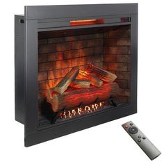 an electric fireplace with the remote control on it's side and flames coming out