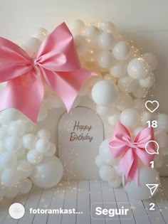 a birthday card with balloons and pink bows on it, next to a photo frame