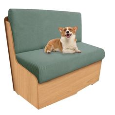 a dog sitting on top of a green chair with wood frame and backrests