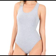 Gray Bodysuit. Cotton. True To Size. Snap Closure. Sleeveless Stretch Gray Bodysuit, Gray Stretch Sleeveless Bodysuit, Fitted Seamless Gray Bodysuit, Fitted Gray Seamless Bodysuit, Fitted Gray Sleeveless Bodysuit, Fitted Sleeveless Gray Bodysuit, Casual Gray Sleeveless Bodysuit, Fitted Gray Bodysuit For Loungewear, Gray Spring Bodysuit For Loungewear