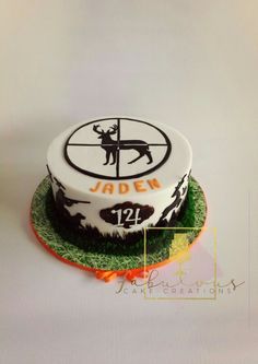 a cake decorated with an image of a deer