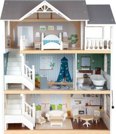 a doll house with all the furniture and accessories in it's three levels,