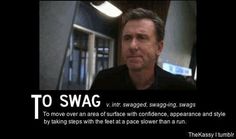 a man is looking at the camera with an ad in front of him that says to swag