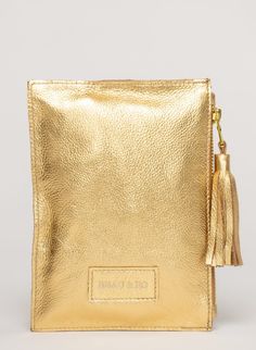 This bag is made from high-quality, super-soft metallic gold leather sourced from a premiere hide house in California. The leather is shipped to New York City, where our bags are produced by expert craftsmen and finished with a smooth zipper, leather tassel, and acrylic ring. Just big enough for all your essentials, we designed the Ring Wristlet to be your go-to bag for going out! Whether you’re heading to a cocktail party, a concert, or out on the town, slip it on your wrist so your hands are f House In California, Acrylic Ring, Shoe Gifts, Big Bags, Metal Ring, Leather Tassel, Bag Dress, Gold Leather, Jewelry Bags