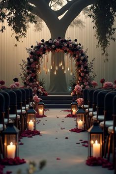 an outdoor ceremony setup with candles and flowers