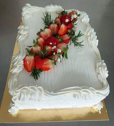 there is a cake with strawberries on it