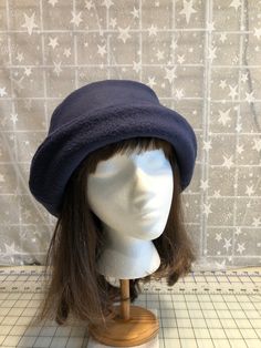 I made this beautiful fleece hat out of a rich navy anti-pill fleece and lined it with a matching color fleece for warmth and body.  It's sized to fit most adults 22-23 inches around head.  The brim can be worn up or down.  It's a very comfortable fit on my 22 1/2 inch head.  Machine wash and dry, gentle cycle. A great travel hat for any season. If you would like a different color, contact me and I'll let you know if I can make it. The last photo is black, to show you what the Rose looks like. Handmade in Oregon. Blue Winter Bucket Hat With Curved Brim, Navy Cap For Winter, Navy Winter Cap, Navy Curved Brim Hat For Winter, Blue Winter Bucket Hat, Travel Hat, Fleece Hat, Winter Hats For Women, Winter Hat