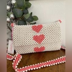 Brand New With Tag White With Pink Heart Beaded Bag. White Shoulder Bag For Valentine's Day, White Beaded Bags For Summer, White Beaded Summer Bags, White Crossbody Bag For Valentine's Day, Summer White Beaded Bags, White Heart-shaped Shoulder Bag For Valentine's Day, White Beaded Bag For Everyday Use, Everyday White Beaded Shoulder Bag, White Rectangular Bags For Valentine's Day