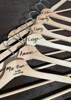 wooden clothes hangers with names on them