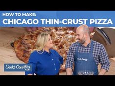 a man and woman standing in front of a chicago thin crust pizza on a cutting board