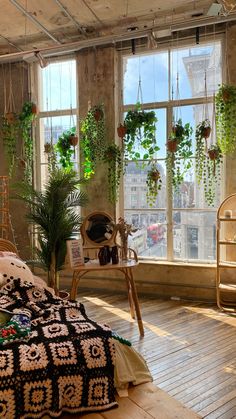 a bedroom with plants hanging from the ceiling