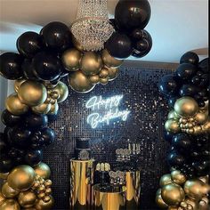 a black and gold birthday party with balloons