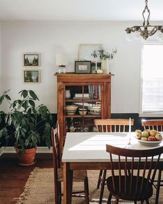 the dining room table is set with fruit on it