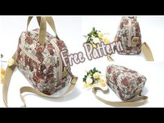 the purse is decorated with flowers and has two straps on one side, and an attached shoulder strap