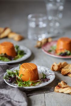 small plates with food on them sitting on a table