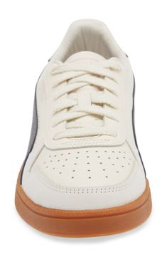 This throwback sneaker emerges from the '80s archives and maintains its sleek silhouette with a low-profile, leather upper and contrast side stripes. Lace-up style Removable insole Leather upper/leather and textile lining/rubber sole Imported Retro Cream Leather Sneakers, Retro Leather Skate Shoes With Laces, Sporty Cream Leather Skate Shoes, Sneaker Men, Side Stripe, Up Styles, Size 13, Low Profile, Rubber Sole