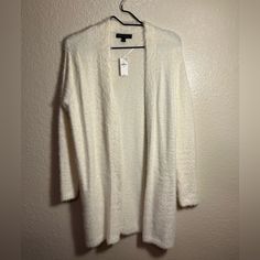 Crdigan Size Xs But Fits S/M It’s Very Stretchy. New With Tags. White V-neck Outerwear For Layering, Cozy White Fall Cardigan, White Cozy Long Sleeve Cardigan, White Casual Cardigan For Layering, Casual White Cardigan For Layering, Cozy White Long Sleeve Cardigan, White V-neck Cardigan For Loungewear, White Cozy Sweater For Spring, White Spring Cardigan For Layering