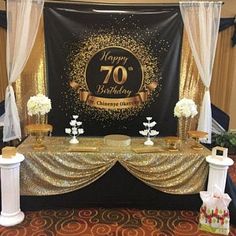 a happy 70th birthday party with gold and white decorations