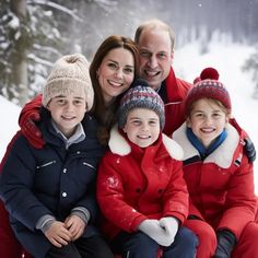 the family is posing for a photo in the snow