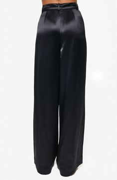 A luxurious sheen amplifies the rich look of these silky satin pants showcasing sweeping wide legs and a fitted high waist. 31 1/2" inseam (size 4) Zip fly with button closure 73% acetate, 27% polyester Dry clean Imported Sleek Silk High-waisted Wide Leg Pants, Satin Straight Pants For Night Out, Straight Satin Pants For Night Out, Sleek Silk Party Bottoms, Chic Silk Wide-leg Bottoms, Chic Silk Wide-leg Pants, Sleek Wide-leg Silk Pants, Sleek Silk Wide-leg Pants, Elegant Satin Bottoms For Evening Wear