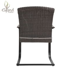 an outdoor wicker chair with black frame and grey seat pad, on white background