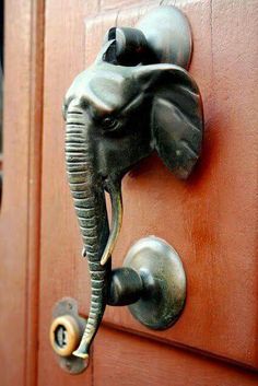 an elephant's head is attached to the door handle