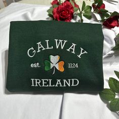 Stay warm and look stylish with this unique Galway Ireland embroidered at the center of the chest. This piece of clothing is perfect for any casual occasion. The high-quality fabric keeps you warm and comfortable, while the intricate embroidery brings a touch of elegance and charm to any ensemble. Whether you're out and about or just lounging at home, this sweatshirt is sure to make you stand out from the crowd. The sweatshirt also features a classic crew neckline and long sleeves for a timeless Embroidered Logo Long Sleeve Sweatshirt, Embroidered Logo Sweatshirt As A Gift, Long Sleeve Sweatshirt With Embroidered Logo Gift, Long Sleeve T-shirt With Machine Embroidery As Gift, Long Sleeve Sweatshirt With Machine Embroidery As Gift, Embroidered Crew Neck T-shirt Gift, Fall Gift Sweatshirt With Embroidered Logo, Long Sleeve T-shirt With Embroidered Logo As Gift, Casual Sweatshirt With Machine Embroidery As Gift