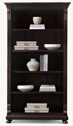 a book shelf with books and vases on it's sides, against a white background