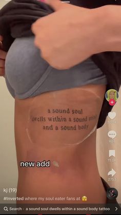 someone is showing off their back with the words on it and an image of a woman's stomach