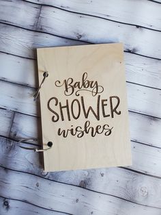 a wooden sign that says baby shower wishes