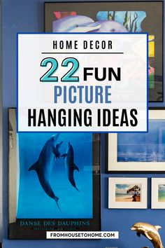 a living room with blue walls and pictures on the wall, including dolphins in water